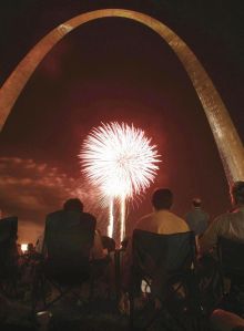 People watch fireworks at the Arch in St