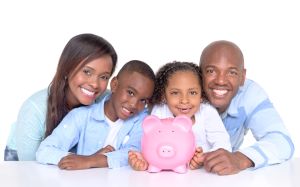Family with their savings in a piggybank